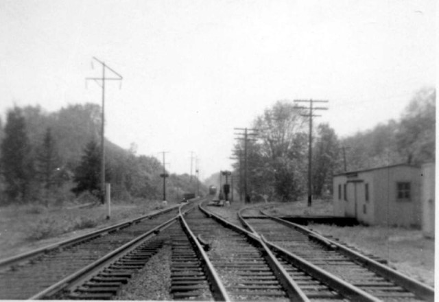 East switch, Monroe siding. Note spring switch signals, and semaphores in distance.  Milwaukee Road Everett Branch curves off to the right, on its way to the Milwaukee mainline at Cedar Falls. Dave Sprau photo.