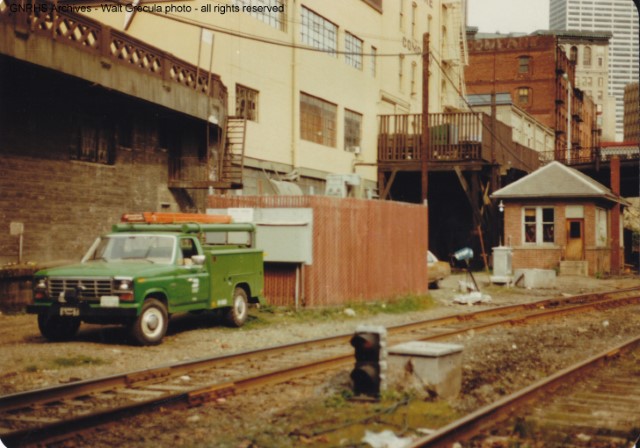 BN-era photo of the GN interlocking "tower" outside the south portal of the downtown Seattle tunnel, just north of King St. Station, Seattle, WA.  Telegraph code "UD".  Photo by GNRHS member Walt Grecula.